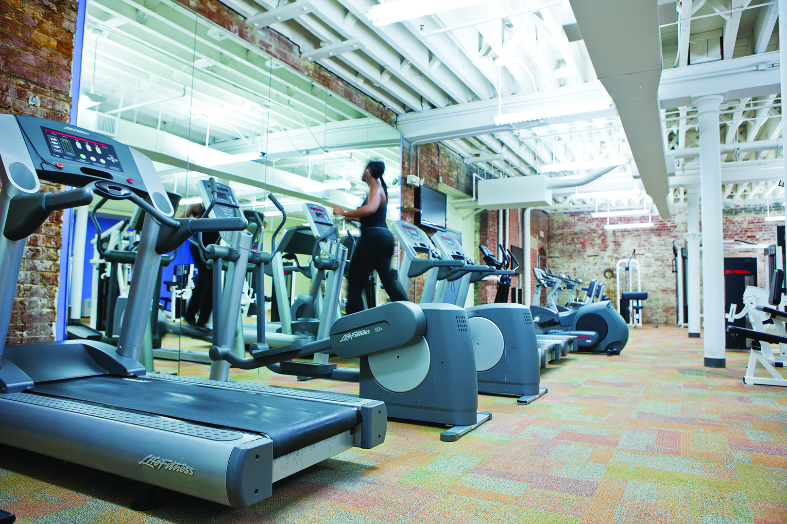 Fitness center at a historic apartment building