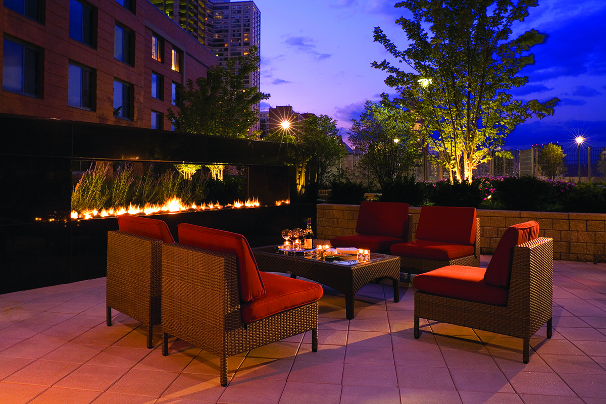 Club Terrace at night of an apartment building