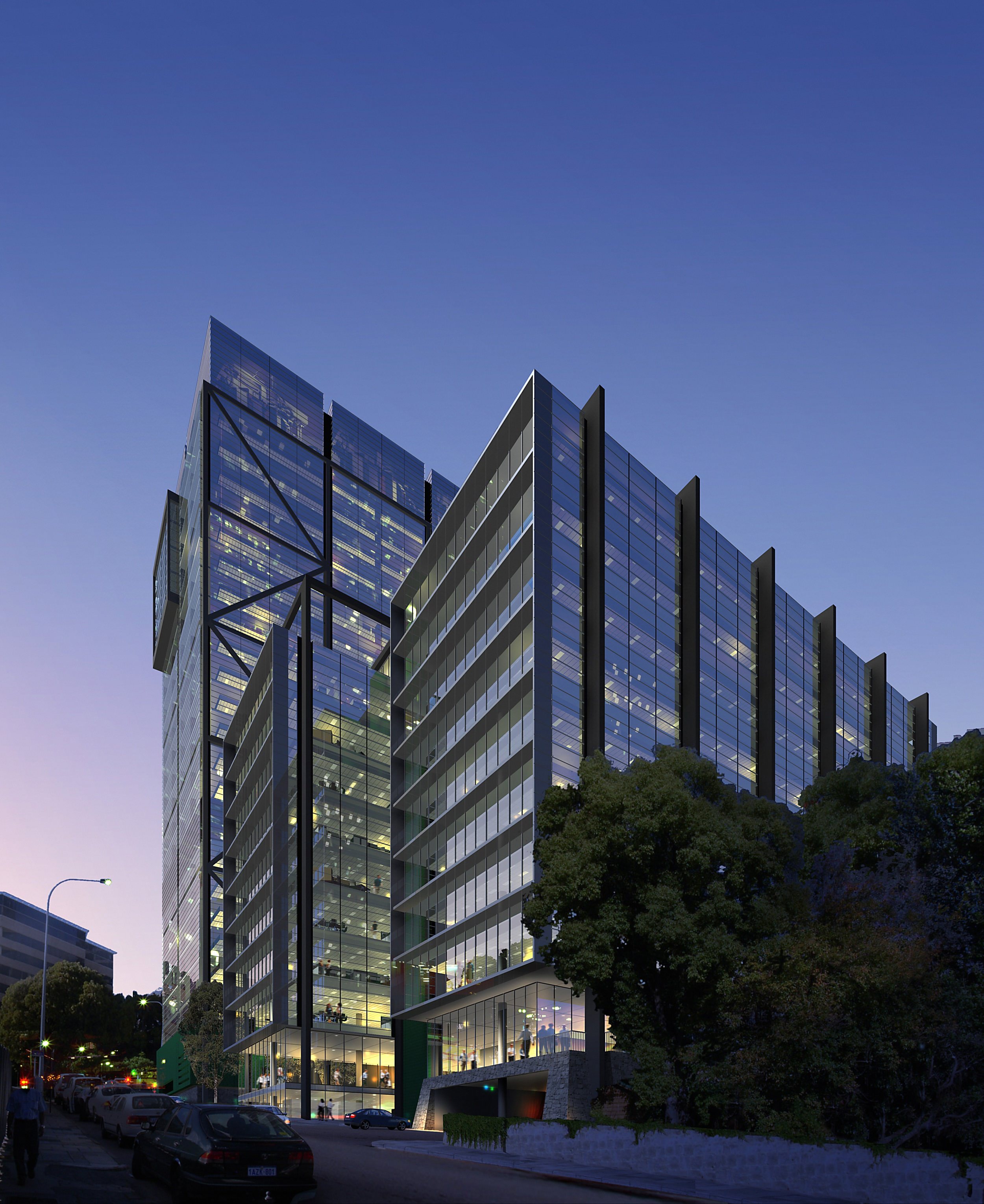 A large glass office building that has many glass panels and some trees that are at the base of it.