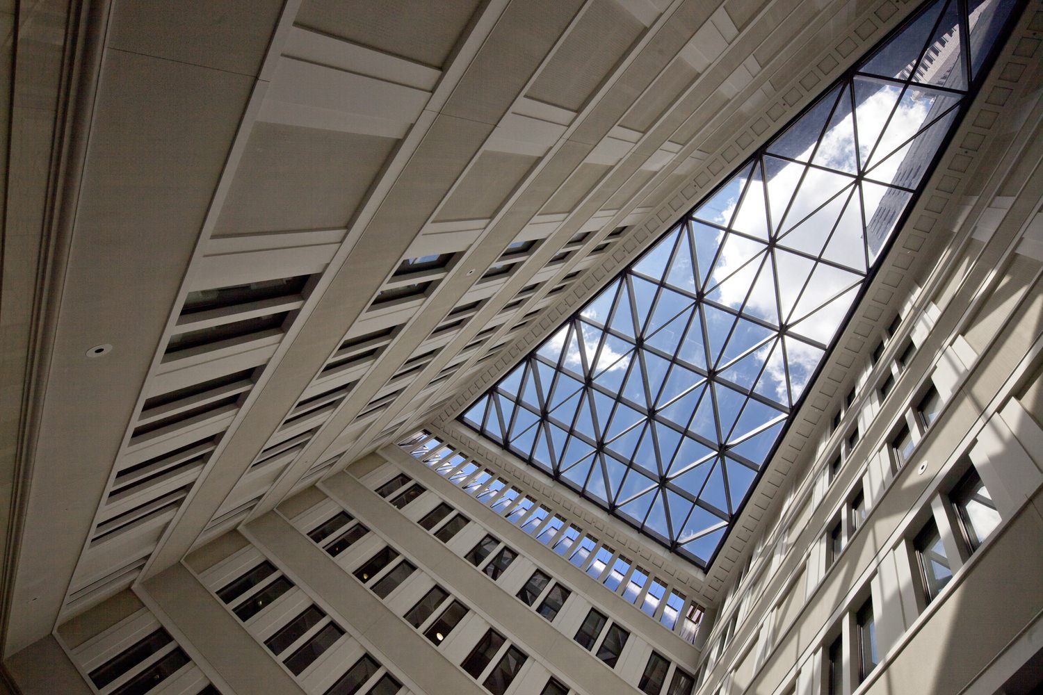 looking up at the sky through a building with Good architect roof with glass frames